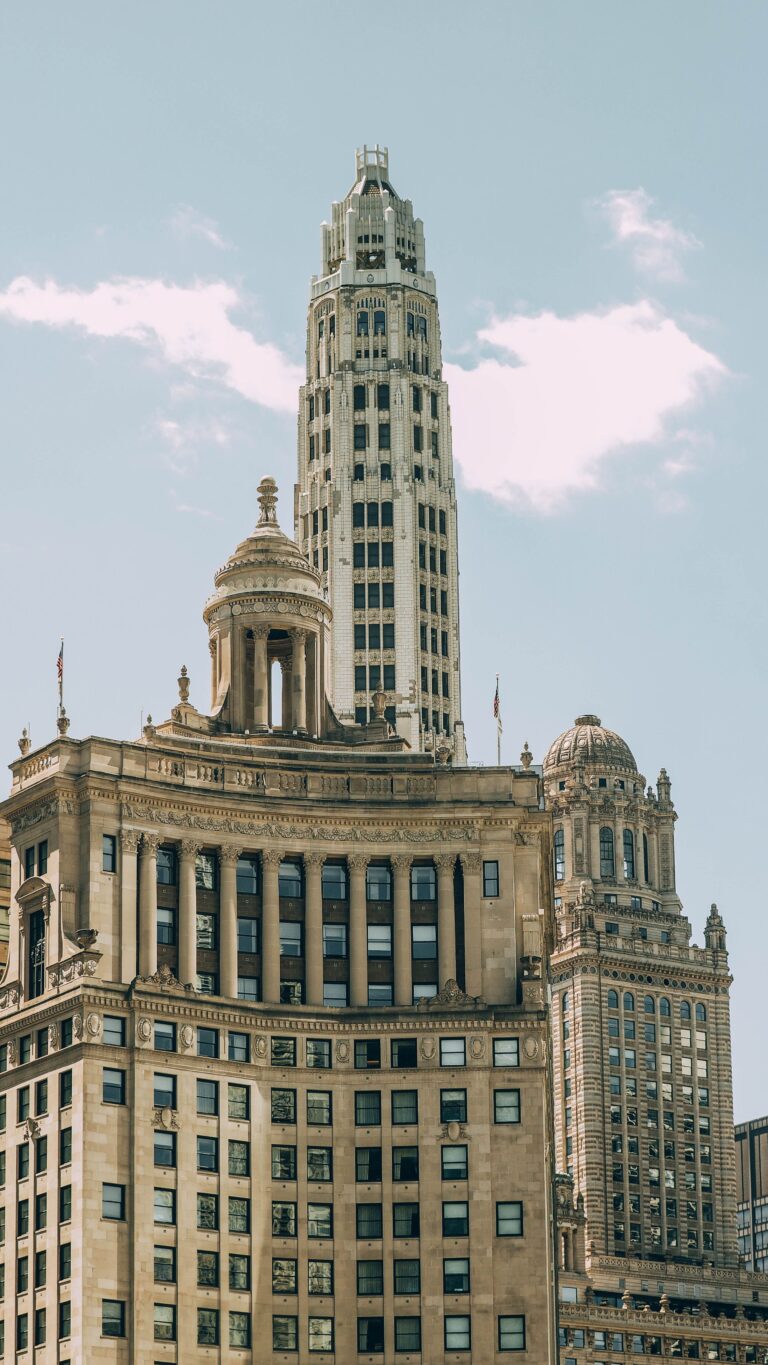 Stunning view of historic skyscrapers against a clear sky, showcasing classic urban architecture.